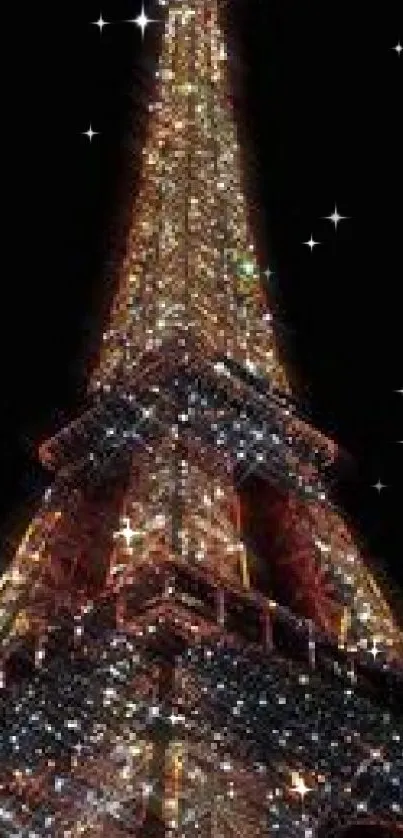 Eiffel Tower adorned in sparkling lights against a black night sky.