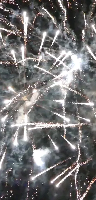 Vibrant fireworks display with bright sparks in the night sky.