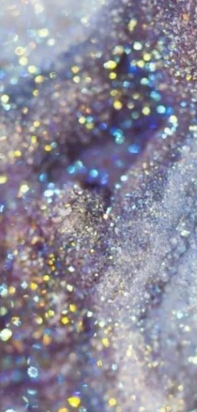 Shimmering glitter with blue and gold hues on a mobile phone wallpaper.