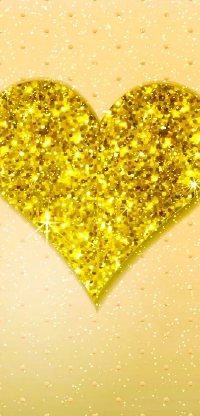 Gold glitter heart design with sparkles on a dotted background.