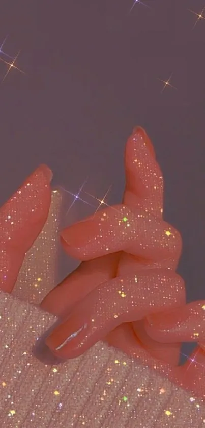 Sparkling hands with glitter on a purple background.