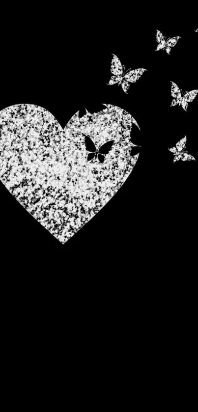 Black wallpaper with a sparkling heart and butterflies.