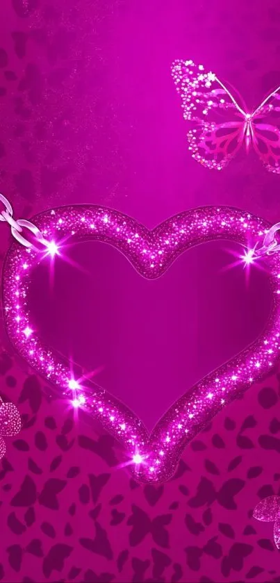 Sparkling pink heart pendant with butterflies on a vibrant background.