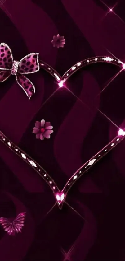 Wallpaper with a sparkling heart and jeweled bow on a dark magenta background.