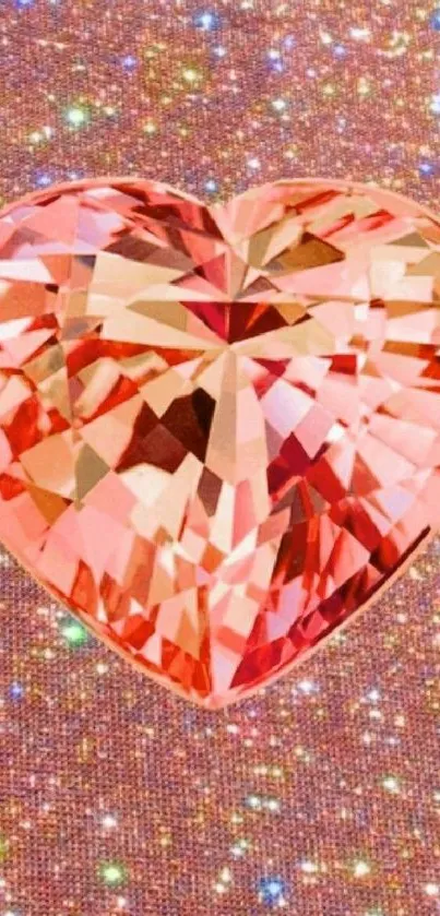 Heart-shaped pink gem on a sparkling background.