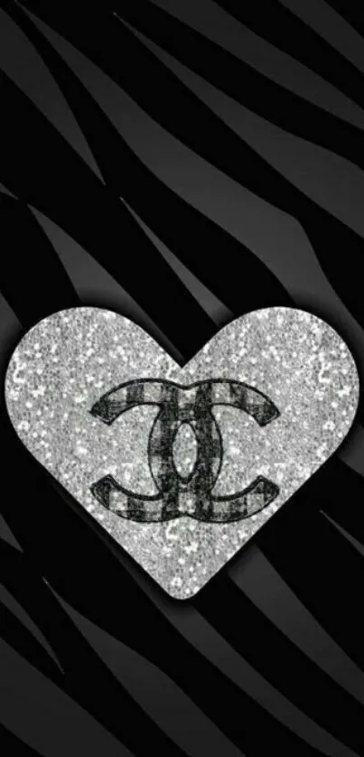 Glittering heart logo on black background wallpaper.