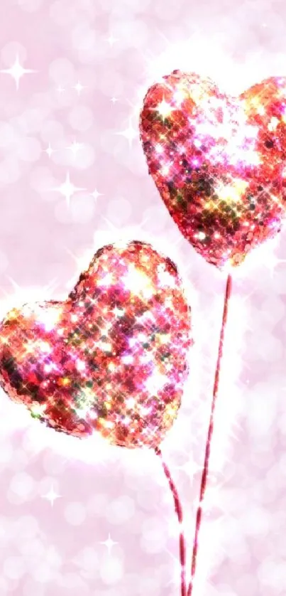 Two sparkling glitter heart shapes on a pink background.