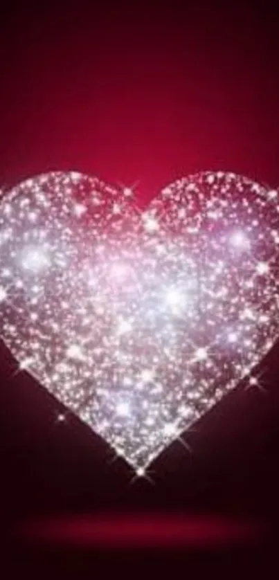 Sparkling heart on deep crimson background, glittering elegantly.