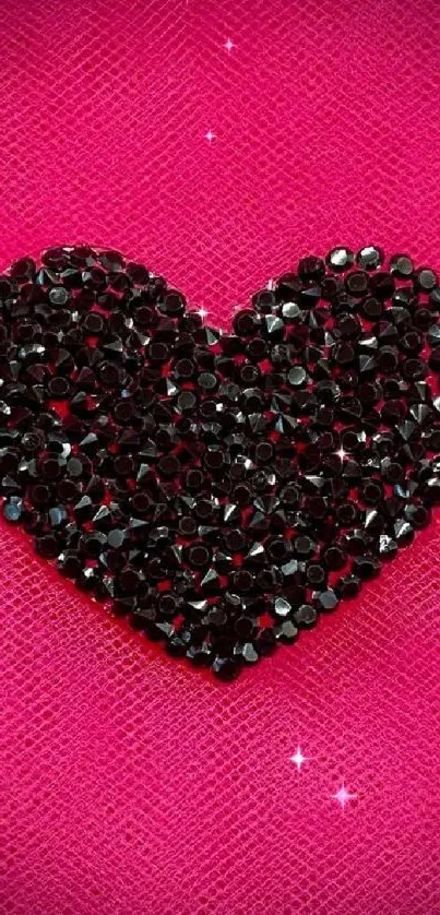 Black sparkling heart on pink textured background wallpaper.