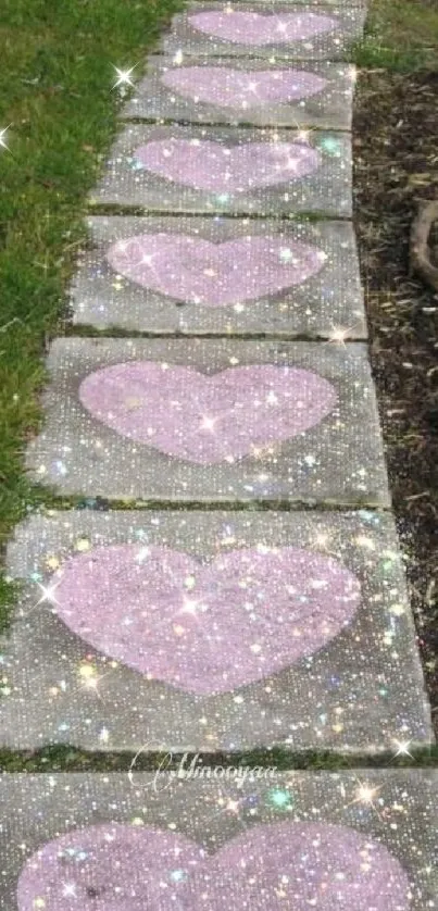 Mobile wallpaper with sparkling pink heart stones on a grassy path.