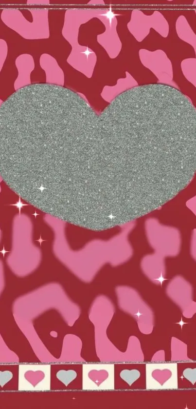 Glittery silver heart on a pink and red patterned background with sparkles.