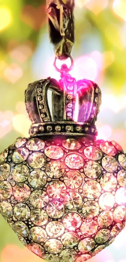 Sparkling heart pendant with crystals in gold and pink glow.