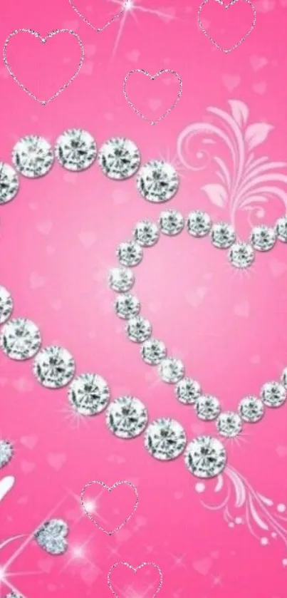 Diamond heart design on pink background wallpaper with sparkling effect.