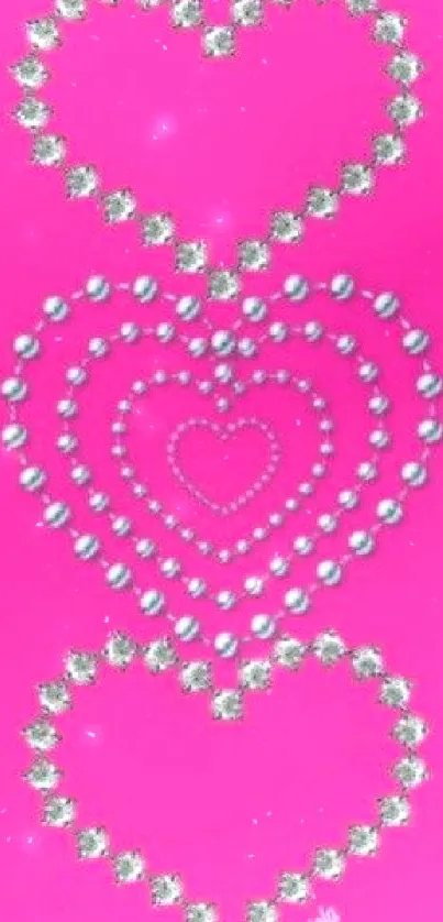 Pink background with silver hearts pattern.