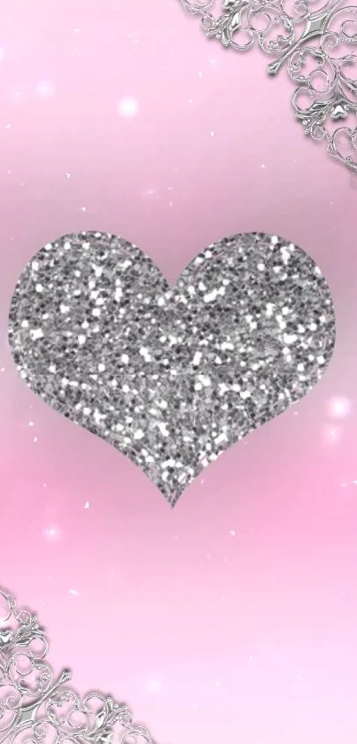 Pink wallpaper with a sparkling silver heart and elegant details.