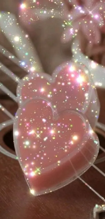 Two pink hearts with sparkles on guitar strings.