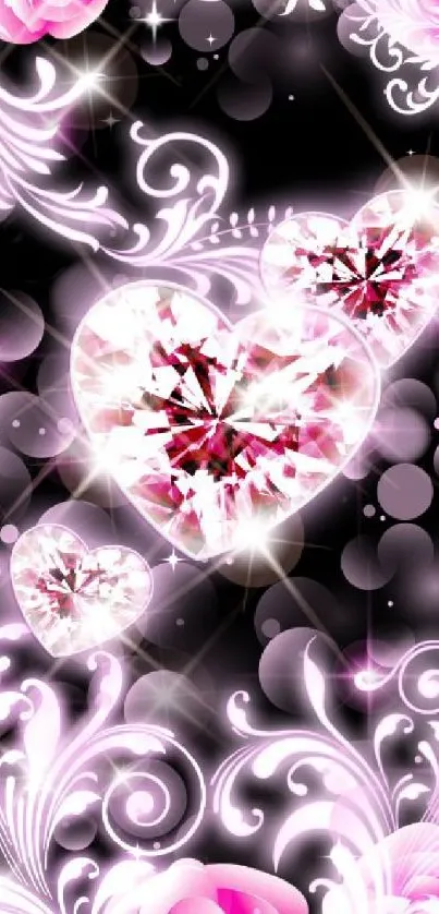 Sparkling diamond hearts with floral patterns on a pink and black background wallpaper.