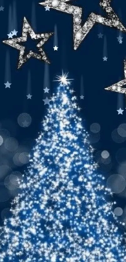 A glowing Christmas tree under three stars on a dark blue background.