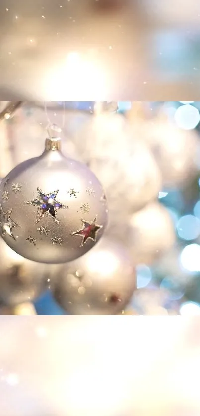 Silver holiday ornaments with festive lights.