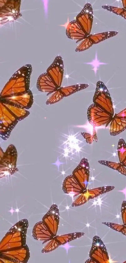 Grey background with sparkling monarch butterflies.