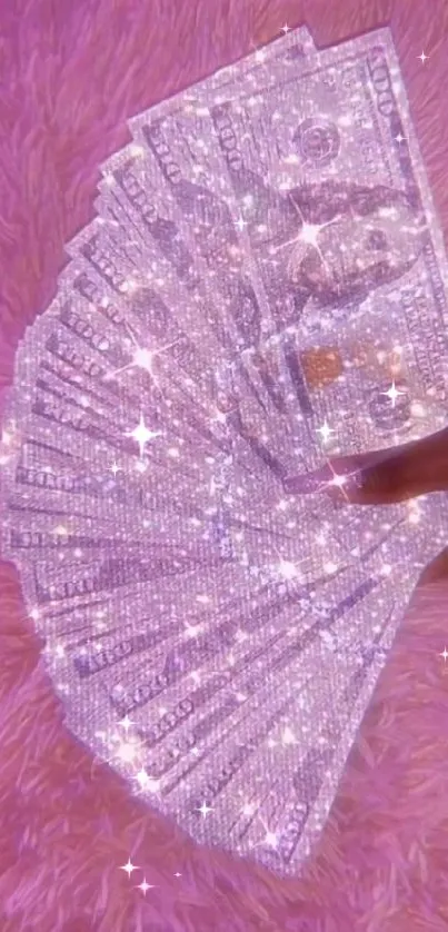 Sparkling dollar bills on pink fur background.