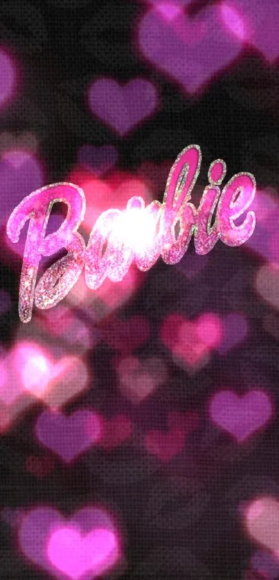 Barbie logo in pink glitter on black background.