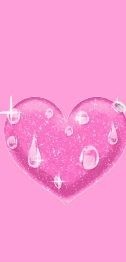 Pink heart with sparkles and glossy raindrops on a pink background.