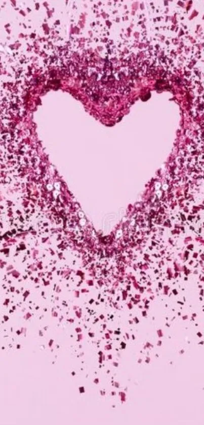 Pink glitter heart shape on pastel background.