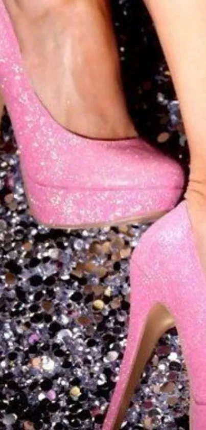 Sparkling pink high heels on glittery background.