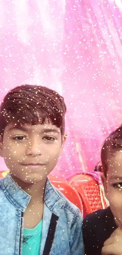 Two kids with a sparkling pink background, bright and playful.