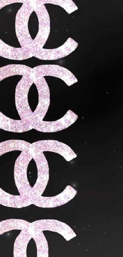 Sparkling pink logo wallpaper on black background.