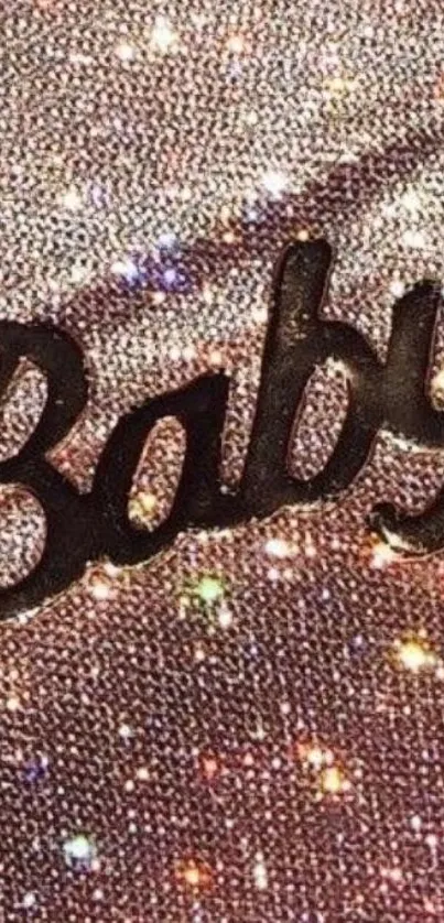 Sparkling pink wallpaper with 'Baby' text for phones.