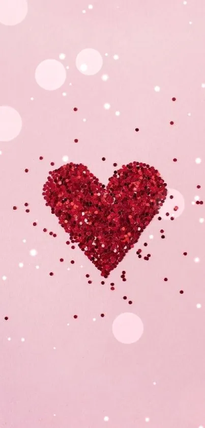 Red sparkling heart on pastel pink background.