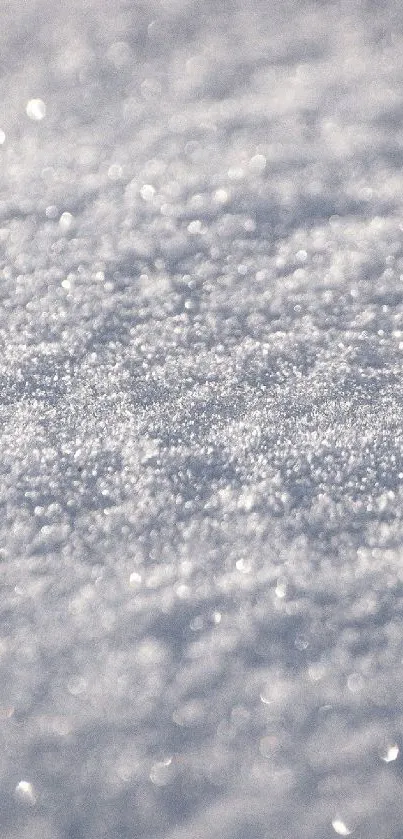 Close-up of sparkling snow texture creating a calming, wintry mobile wallpaper.