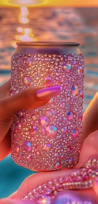 A rhinestone-encrusted can reflecting a sunset over water.