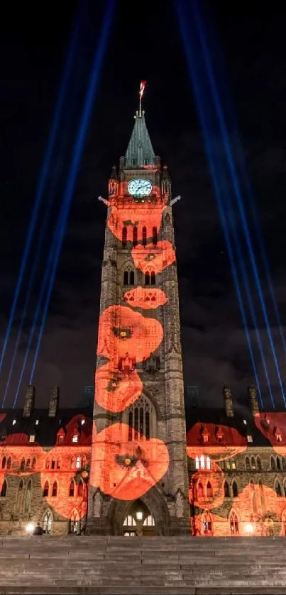 Tower illuminated with poppy projections at night.