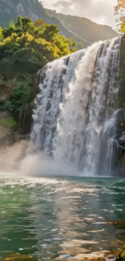 Beautiful waterfall surrounded by lush green forest and clouds.