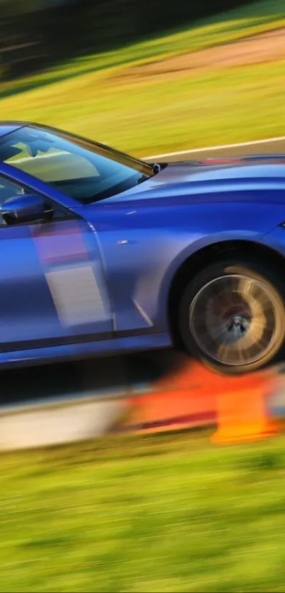Blue sports car speeds on a race track, capturing motion and excitement.