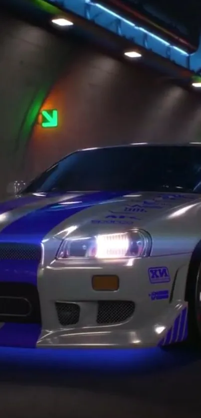 Sleek car speeds in neon-lit tunnel, vibrant blue glow.