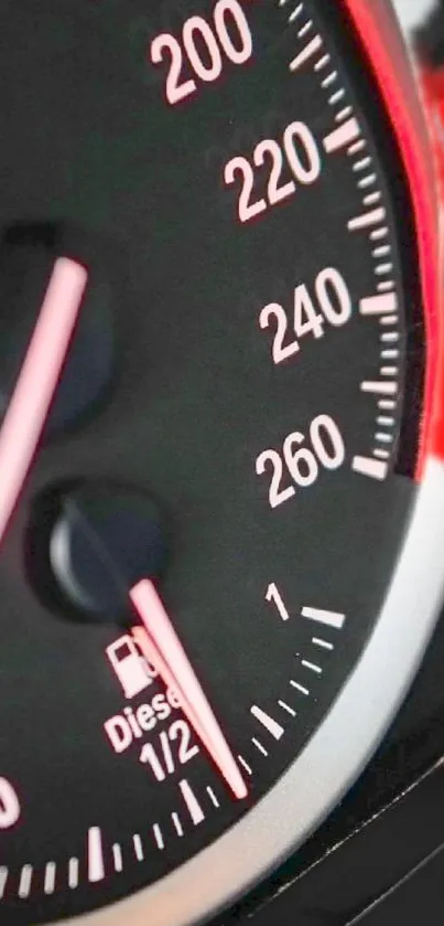 Mobile wallpaper featuring a car's speedometer with black and red accents.