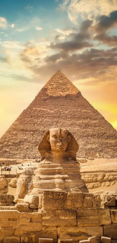 Golden sunset behind Sphinx and Pyramid in Egypt.