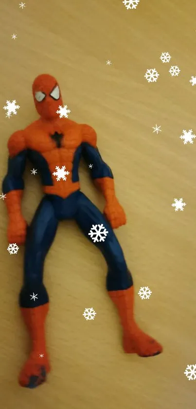 Spider-Man action figure on wooden surface.