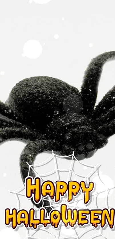 Eerie black spider with 'Happy Halloween' text on web design.