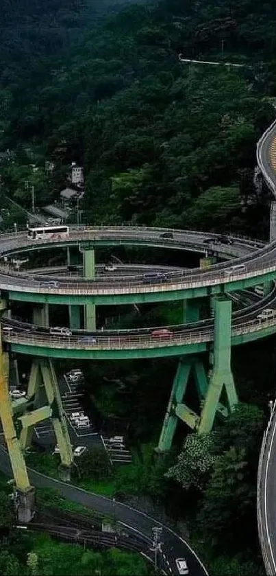 Aerial view of a spiral mountain road surrounded by lush greenery.