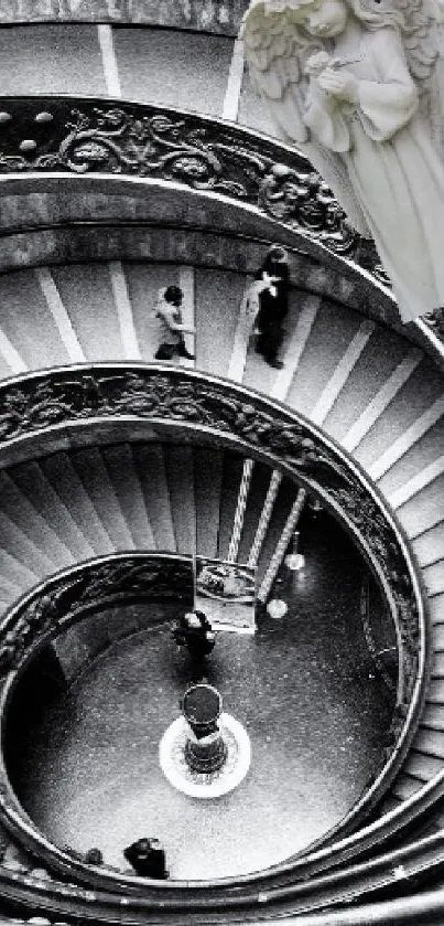 Monochrome spiral staircase with an angel figure.