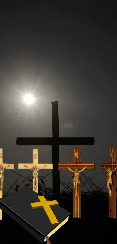 Religious mobile wallpaper featuring multiple crosses and a Bible under a dark sky.