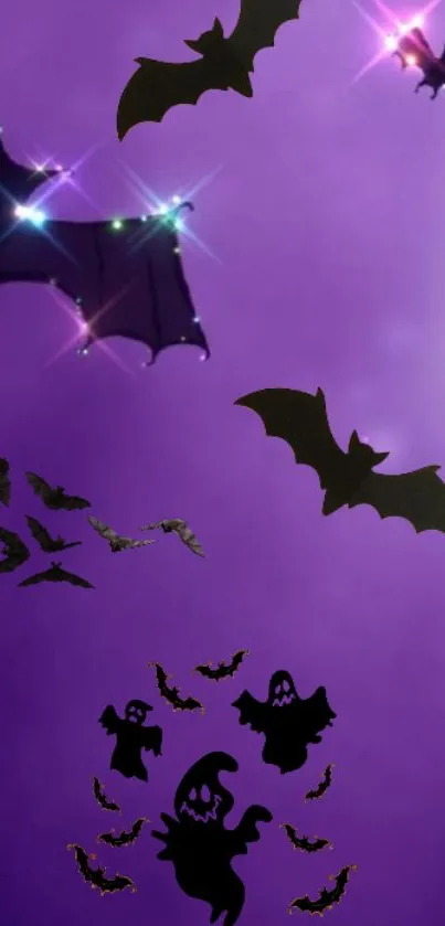 Halloween wallpaper with bats and ghosts on a purple background.