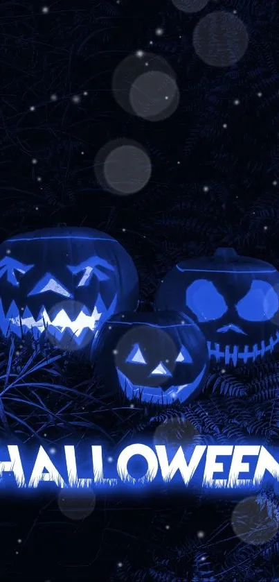 Eerie blue Halloween wallpaper with glowing pumpkins.