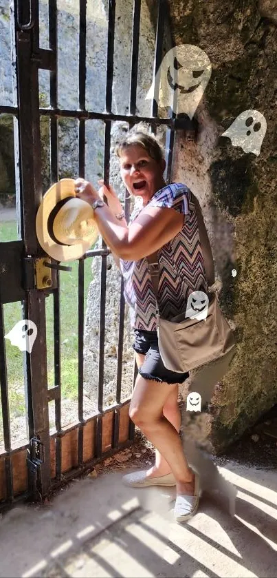 A woman with cartoon ghosts by a shadowy gate, creating a spooky atmosphere.