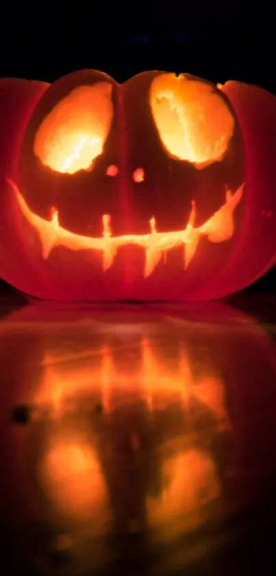 Glowing Jack-O'-Lantern with spooky face on a dark background.